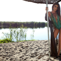 Hot babe Lexi Parker relaxes at the beach on a warm summers day