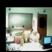 Veiled Arab secretary blowing white manager