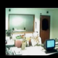 Veiled Arab secretary blowing white manager