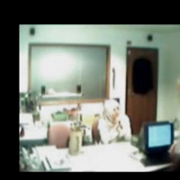 Veiled Arab secretary blowing white manager