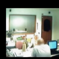 Veiled Arab secretary blowing white manager