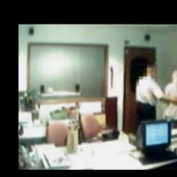 Veiled Arab secretary blowing white manager