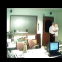 Veiled Arab secretary blowing white manager