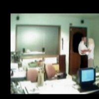 Veiled Arab secretary blowing white manager