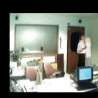 Veiled Arab secretary blowing white manager