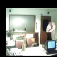 Veiled Arab secretary blowing white manager