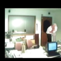 Veiled Arab secretary blowing white manager