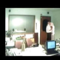 Veiled Arab secretary blowing white manager