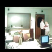 Veiled Arab secretary blowing white manager