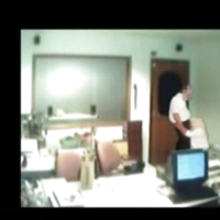 Veiled Arab secretary blowing white manager