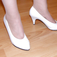 Slutty secretary in tights and white stilettos