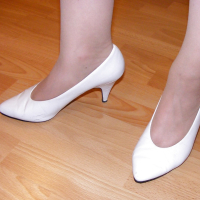 Slutty secretary in tights and white stilettos