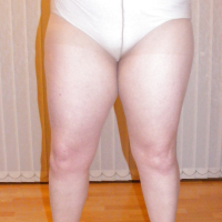 Slutty secretary in tights and white stilettos
