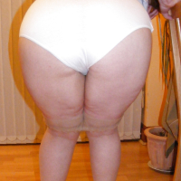 Slutty secretary in tights and white stilettos