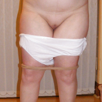 Slutty secretary in tights and white stilettos
