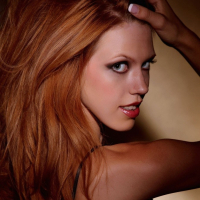 Redhead Pepper Kester stripping off her black Lingerie