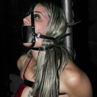 Delilah Strong bound in leather straps getting here body tickeld