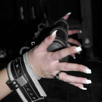 Delilah Strong bound in leather straps getting here body tickeld