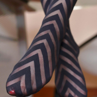 European chick Mira Sunset modeling sexy stockings in home office