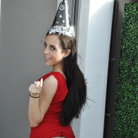 Brunette slut Roxanne Rae is teasing her tight ass in a red skirt