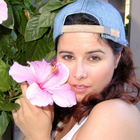 MILF in cap Chloe Vevrier tends the flowers and reveals her giant boobs