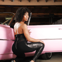 Tall ebony model Misty Stone letting nice black boobs free from dress