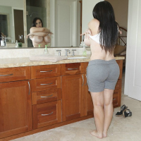 Curvaceous MILF Daphne Rosen slipping on her lacy panties and red dress
