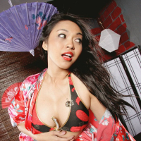Asian milf babe Mika Tan spreading legs showing big tits and round ass