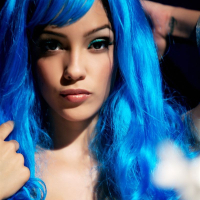 Melanie Jane takes off her beaded outfit in a hot blue wig