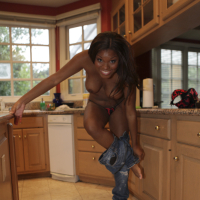 Hot african babe Candice Nicole strips off jeans and shows big tits