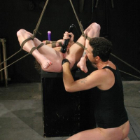 Bound Audrey Hollander gets a candle in her ass with fucking