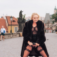 Blonde chick Silvia Saint flashing her pink pussy outdoors