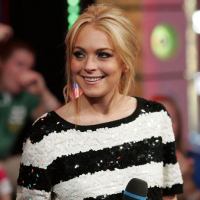 Celebrity Lindsay Lohan in windy gray dress and nice upskirt