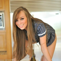Capri Anderson Using A Wine Bottle