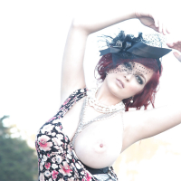Busty redhead Tessa Fowler flashing her huge knockers on beach