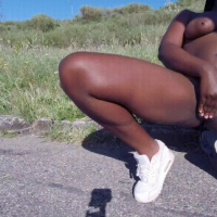 Sexy ebony Stripping Outside