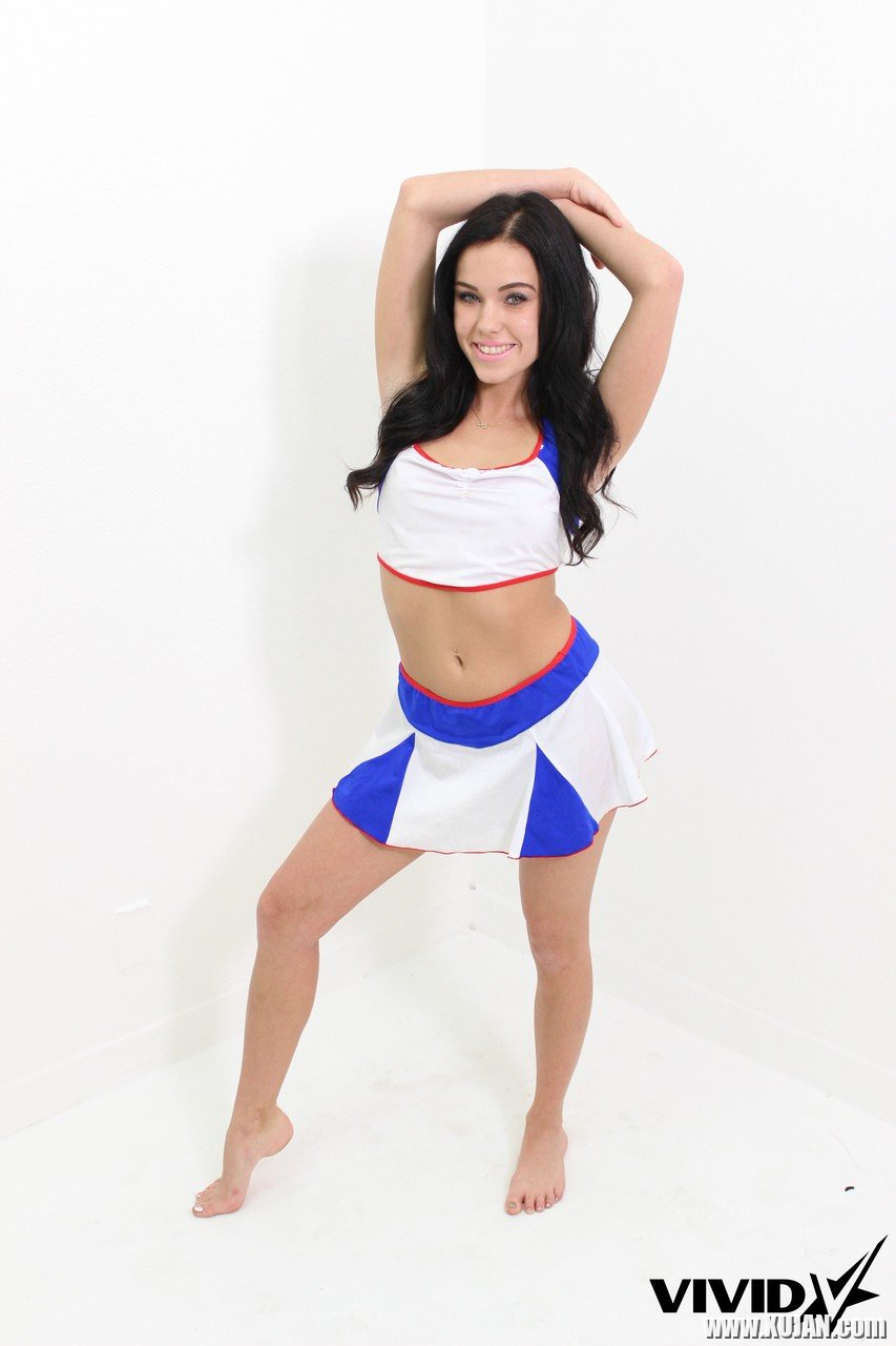 Playful cheerleader Megan Rain strips exposing her naked curves - Photo #1152468