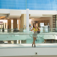Hot coed April Brookes gives you some peeks up her skirt at a public mall