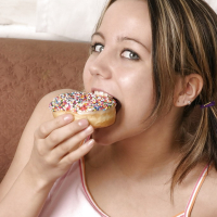 Andi Pink Eattinh Her DonutsWith Cute Pigtails