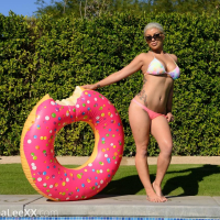 Busty hottie Birana Lee strips in her bikini outside