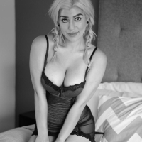 Busty beauty Briana Lee masturbates in black and white