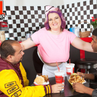 Chubby waitress Porsche Dali flashes her massive jugs at work
