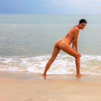 Julia V Earth in red bikini at the beach