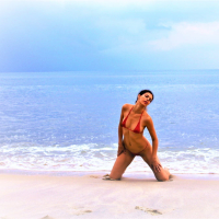 Julia V Earth in red bikini at the beach