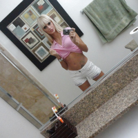 Blonde exgirlfriend Erica Fontes taking mirror self shots while undressing