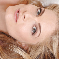 Graceful blonde babe Cayenne Klein posing naked and fingering her pussy
