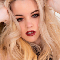 Masked blonde babe Lauren WK seduces you in black silk stockings and high heels