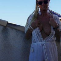 Good looking babe Natalie K sunbathing and rubbing her cunt