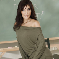 Tempting teacher in stockings Diana Prince slipping off her clothes