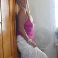 Sexy blonde chick Natalie K lifts up her skirt and shows her pussy